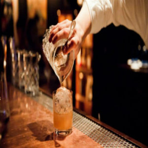 Bartender pouring drinks